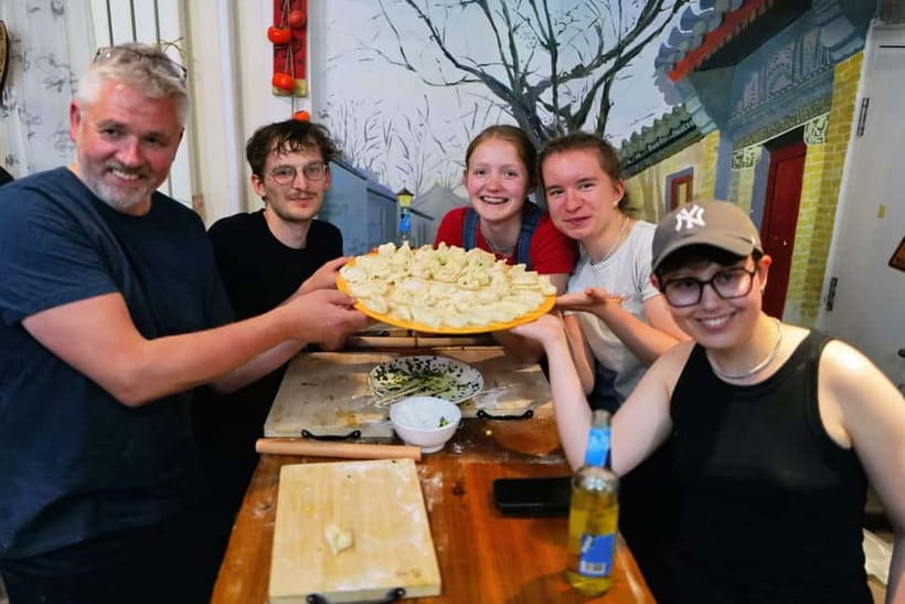 Beijing: Dumpling Making Workshop with Meal and Tea - Rolling wrappers and shaping the dumplings