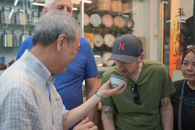 Hong Kong Street Food Tour with Locals - Dim Sum, Wonton & more - Bonham Strand West explains Hong Kong’s trading spirit