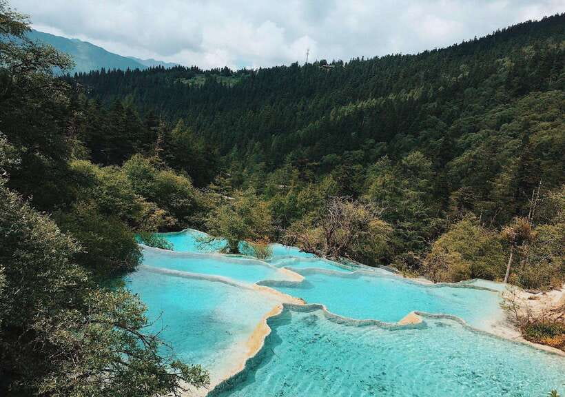 Huanglong Scenic Area: Explore Stunning Five-Colored Ponds - Is the organization helpful for international visitors?