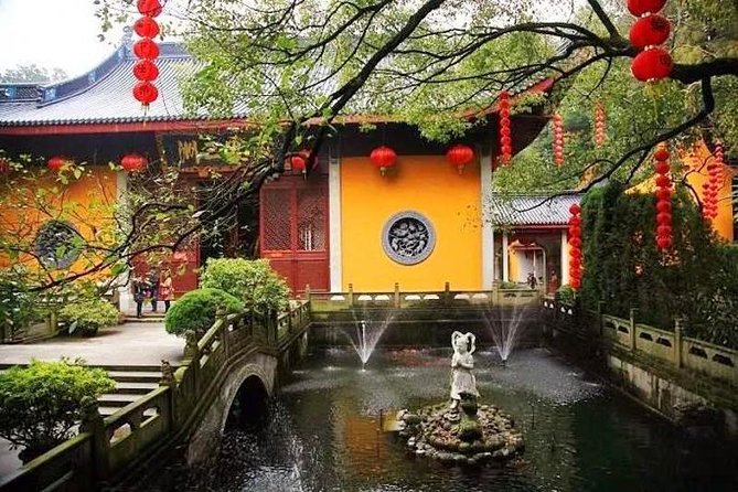 Private Full Day Tour : Customizable Hangzhou City Highlights with Multi Options - Fei Lai Feng: stone carvings in a wooded setting