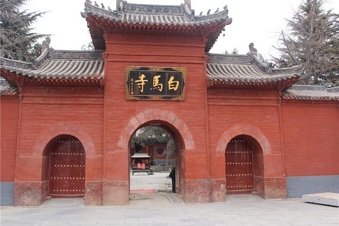Private Luoyang Day Tour: Longmen Grottoes and White Horse Temple - Walking through the Longmen Grottoes