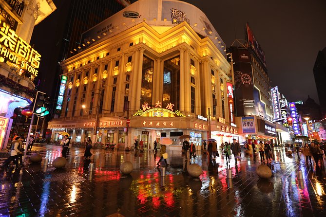 Private Shanghai Evening Street Food Walking and Cruise Tour - Walking through the Old Town Bazaar toward the Bund