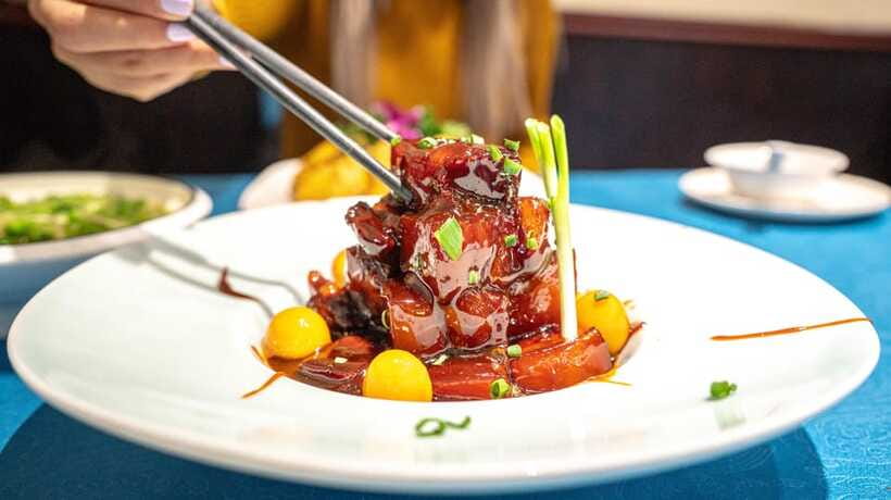 Shanghai: Evening Walking Food Tour - Shanghainese pork belly takes center stage