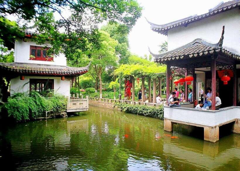 Shanghai: Zhujiajiao Private Tour w/ Boat Ride & Garden - Crossing Zhujiajiao’s old bridges